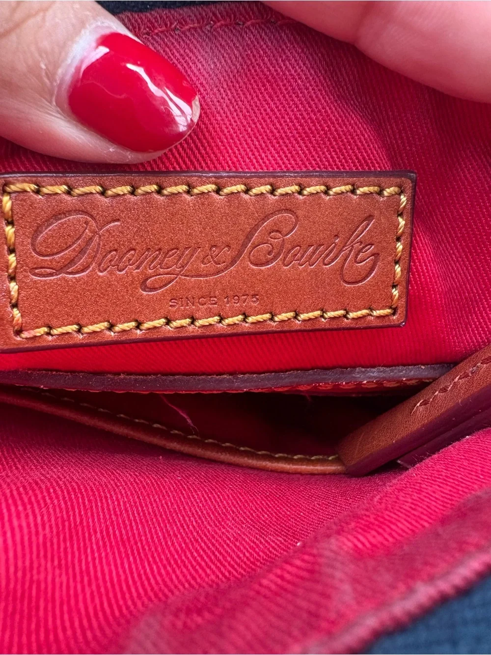 Dooney & Bourke navy with Brown Trim Monogram Crossbody